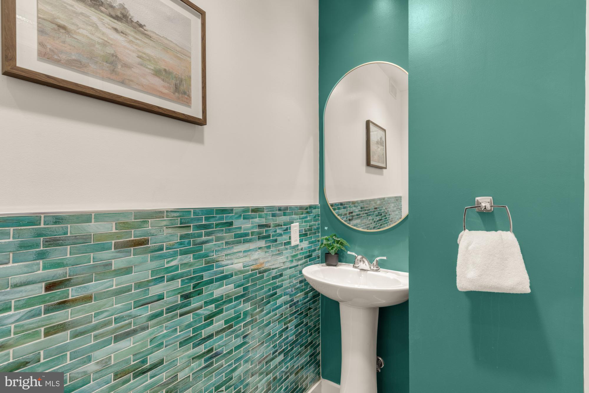 1213 Battery Avenue Baltimore, MD 21230 - Photo 10 of 39 a bathroom with a sink a mirror and a toilet