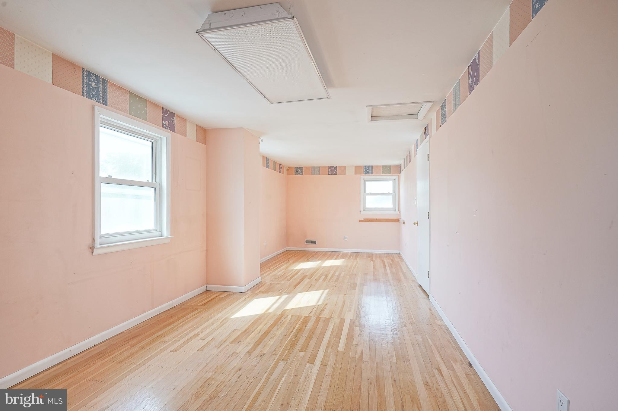 152 Kelly Driver Road Laurel Springs, NJ 08021 - Photo 22 of 30 a view of empty room with wooden floor and fan
