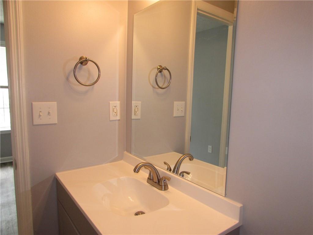 835 Heritage Valley Road Norcross, GA 30093 - Photo 27 of 34 a bathroom with a sink and a mirror