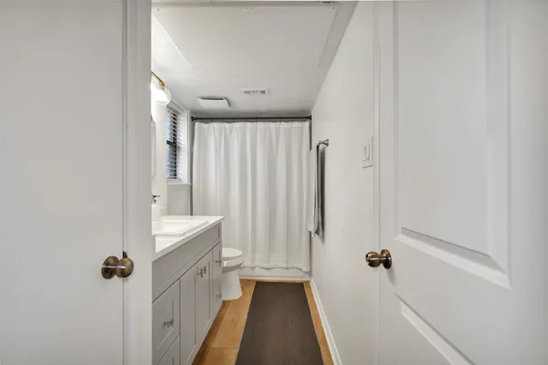 a view of a bathroom from the hallway