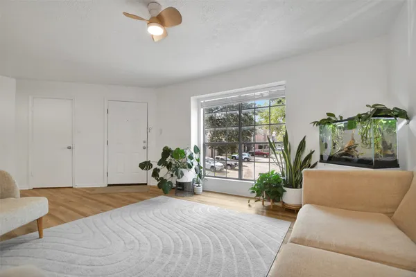 a bedroom with furniture and a potted plant