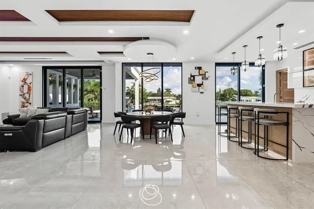a view of a living room and entryway with furniture