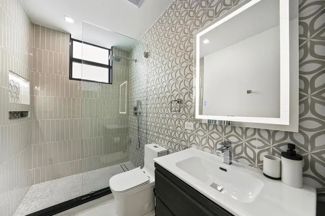 an aerial view of a house with a garden