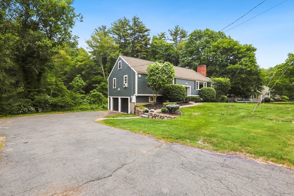 5 Fox Run Road Topsfield, MA 01983 - Photo 19 of 23 a front view of a house with a yard