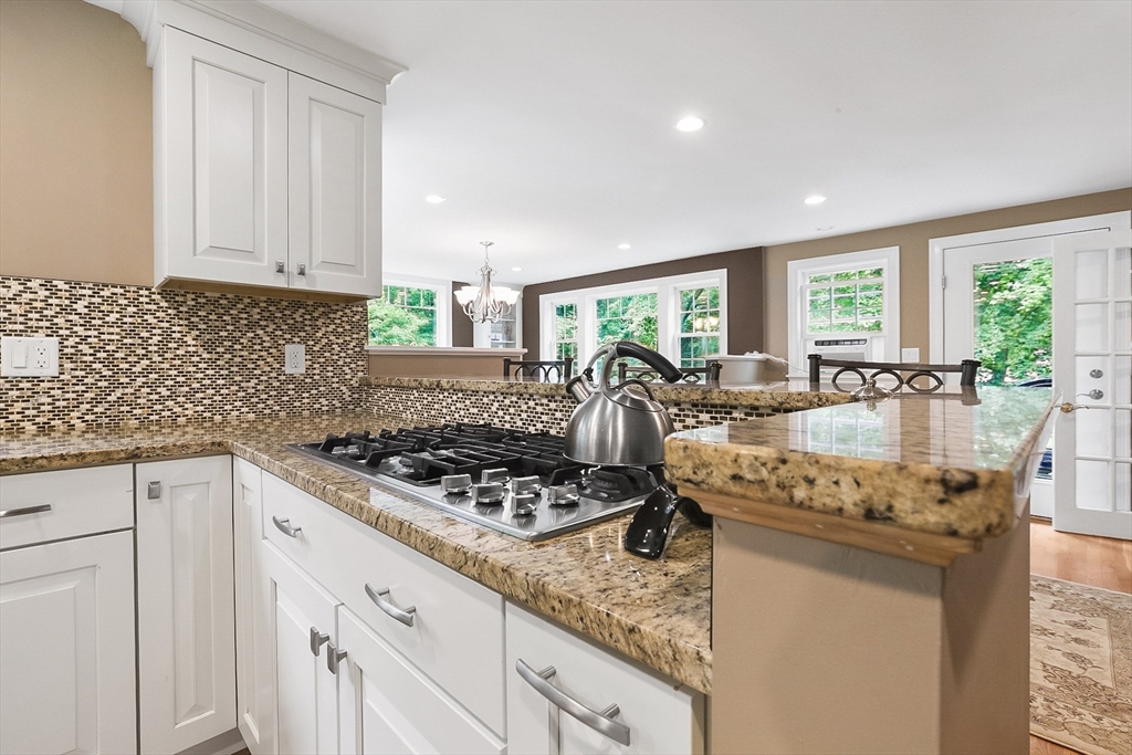 5 Fox Run Road Topsfield, MA 01983 - Photo 5 of 23 a kitchen with granite countertop stainless steel appliances a stove sink and cabinets