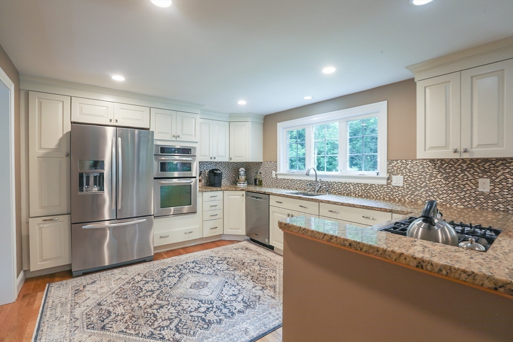 5 Fox Run Road Topsfield, MA 01983 - Photo 6 of 23 a kitchen with granite countertop a refrigerator and a sink