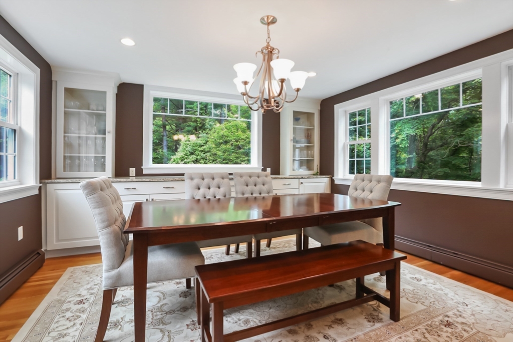 5 Fox Run Road Topsfield, MA 01983 - Photo 8 of 23 a view of a dining room with furniture a chandelier and wooden floor