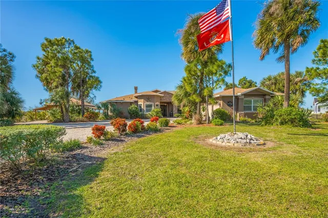a kitchen with stainless steel appliances granite countertop a sink a stove cabinets and a refrigerator