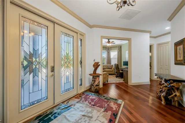 a living room with furniture fireplace and flat screen tv