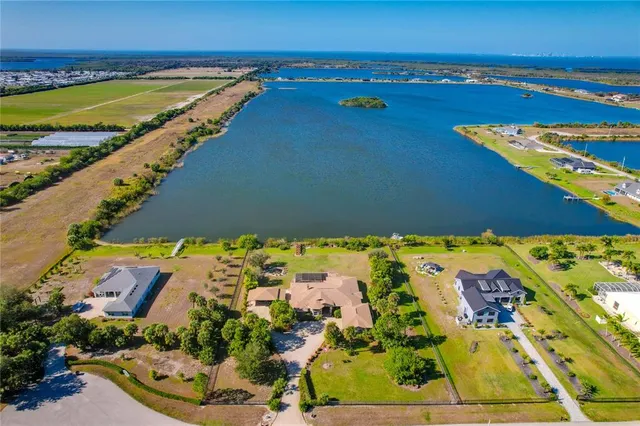 a large kitchen with a table and chairs in it
