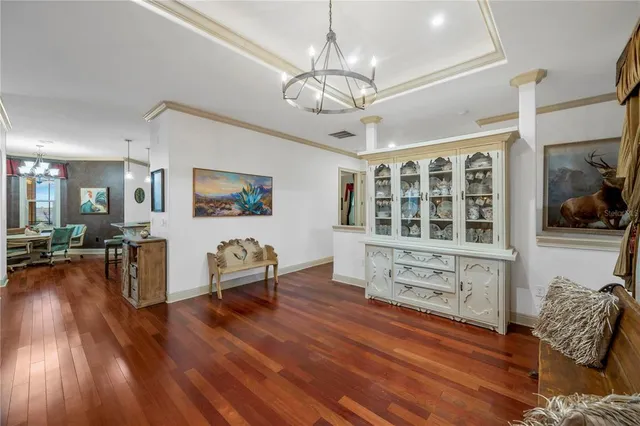 a bedroom with a large bed and a flat screen tv