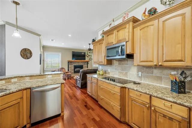 a view of a backyard with a patio and dining space