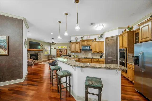 a living room with furniture and floor to ceiling windows