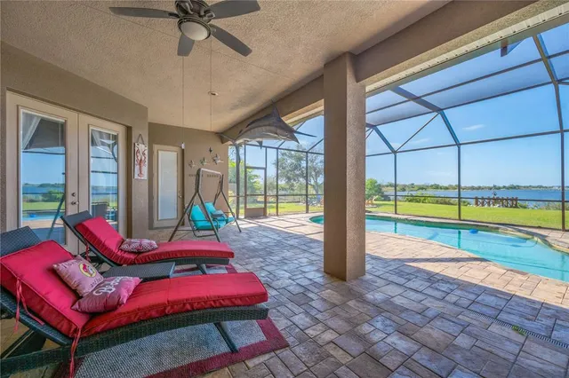 a living room with lots of furniture and clutter