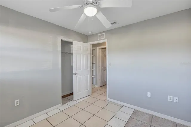 a bathroom with a granite countertop sink toilet and bathtub