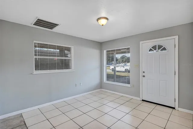 a view of an empty room and window