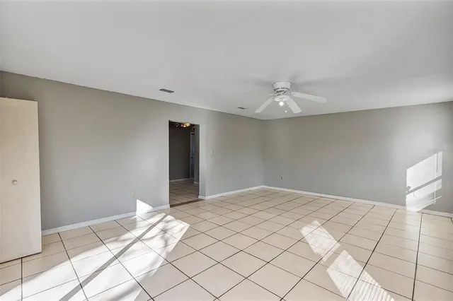 a view of an empty room with a window