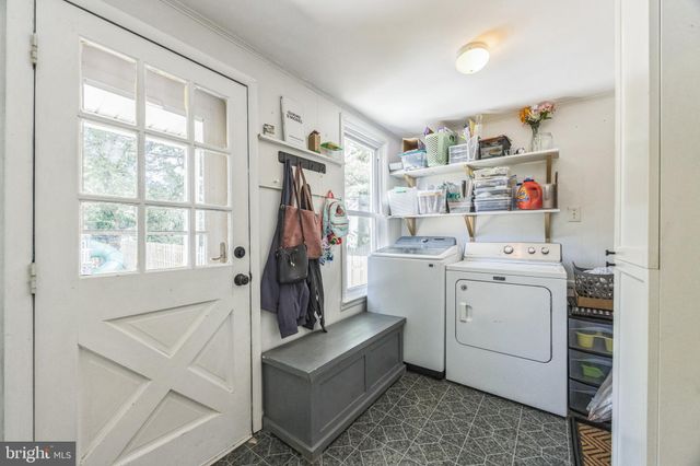 a view of storage and utility room with washer and dryer