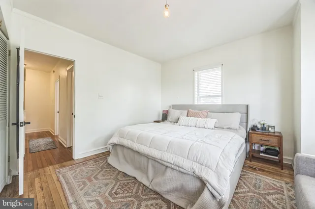 a bedroom with a bed and a view of bedroom