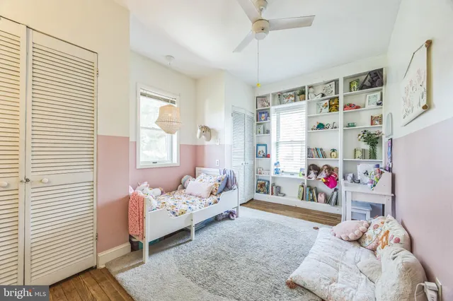 a bedroom with furniture and a window