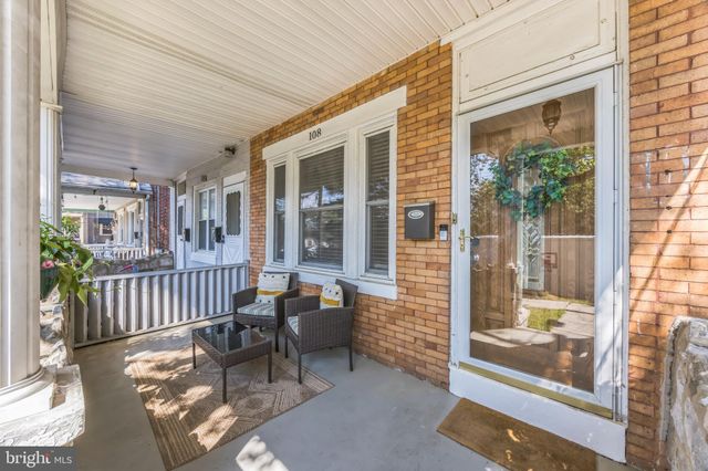 a view of a patio with a chairs and table in a patio