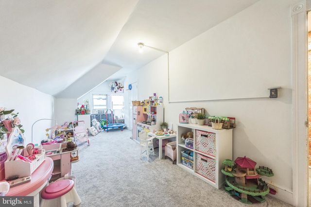a view of a play room with toys and toys