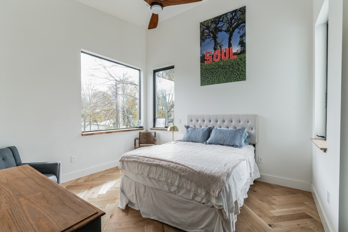 107 Blue Ridge Trail Austin, TX 78746 - Photo 20 of 38 Bedroom featuring a ceiling fan and baseboards