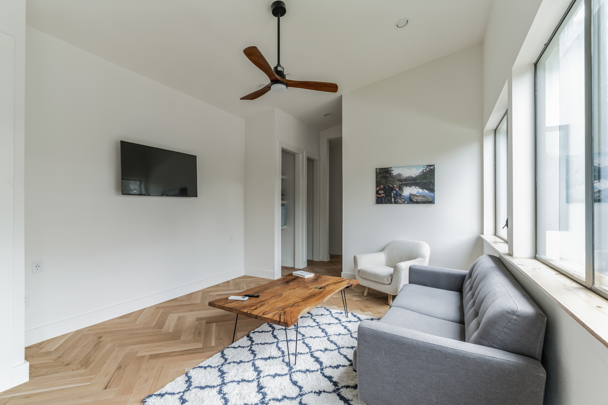 107 Blue Ridge Trail Austin, TX 78746 - Photo 21 of 29 a bedroom with furniture and a flat screen tv