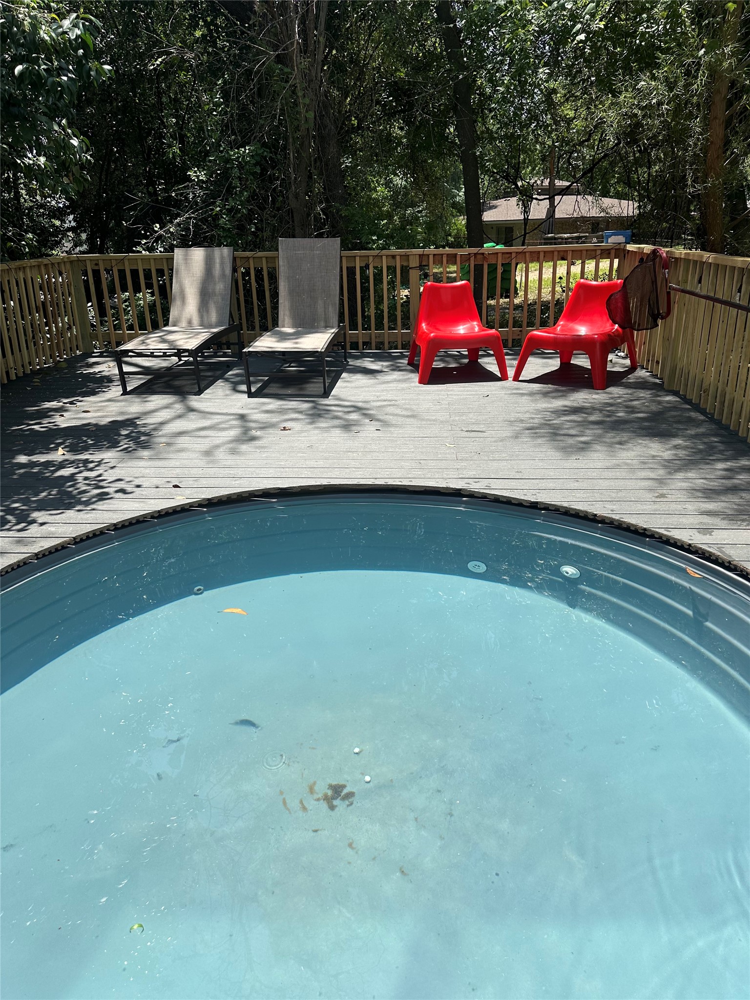 107 Blue Ridge Trail Austin, TX 78746 - Photo 29 of 29 a view of a wooden deck and a backyard