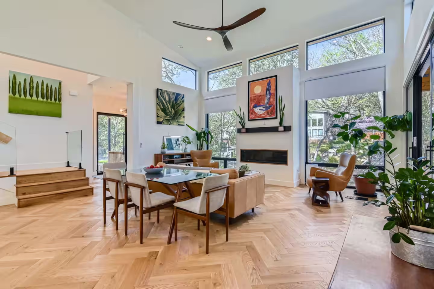 107 Blue Ridge Trail Austin, TX 78746 - Photo 3 of 29 a living room with furniture a fireplace and a large window