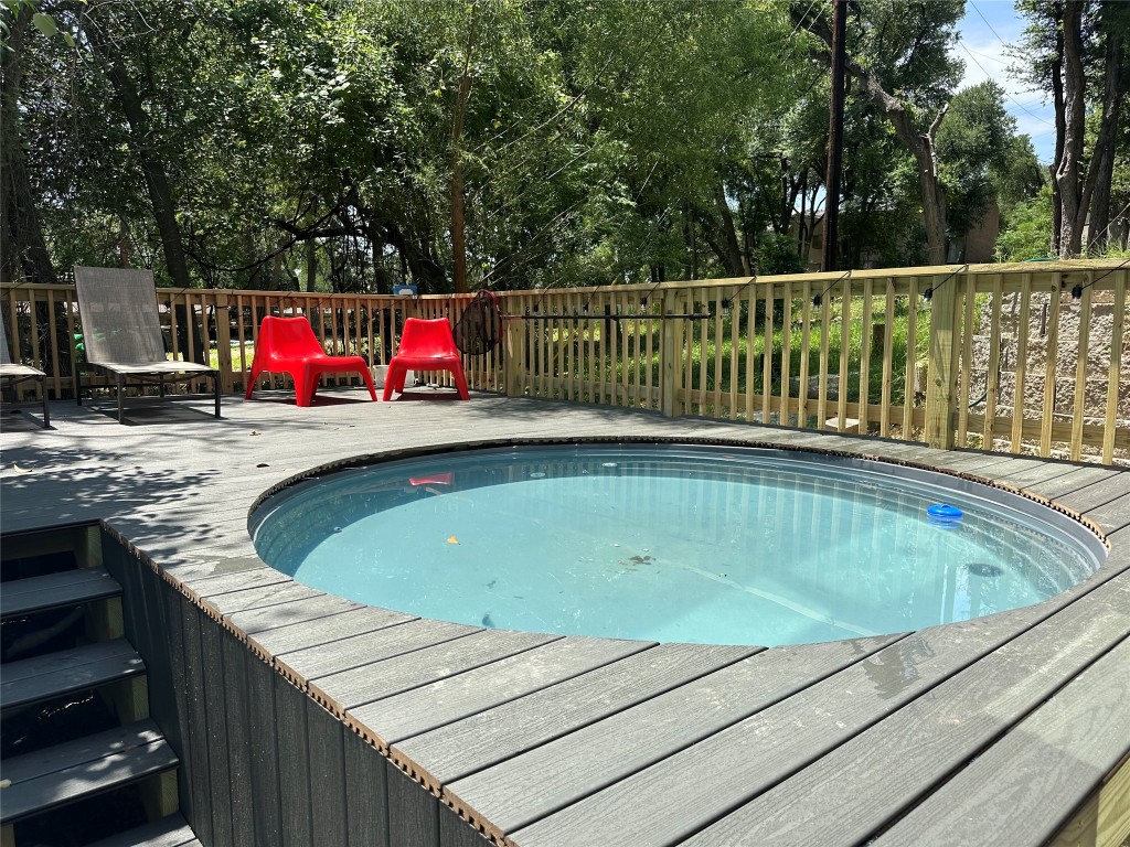 107 Blue Ridge Trail Austin, TX 78746 - Photo 36 of 38 View of swimming pool with a wooden deck and a hot tub