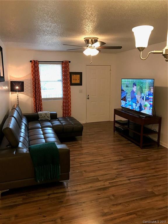 4200 Raney Way Charlotte, NC 28205 - Photo 6 of 12 a living room with furniture and a flat screen tv