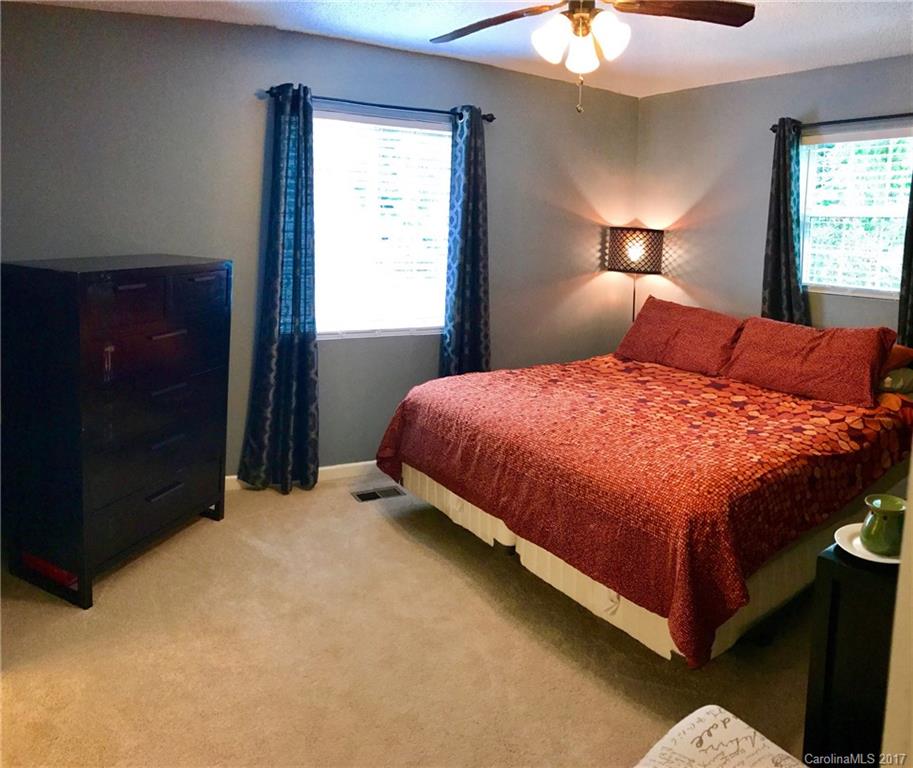 4200 Raney Way Charlotte, NC 28205 - Photo 9 of 12 a bedroom with a bed and a window