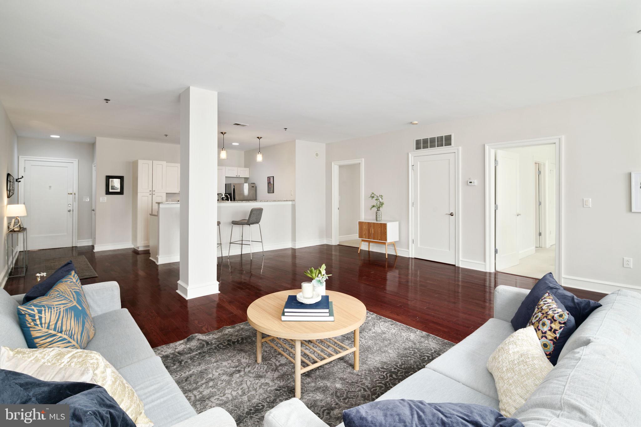 a living room with furniture and a table