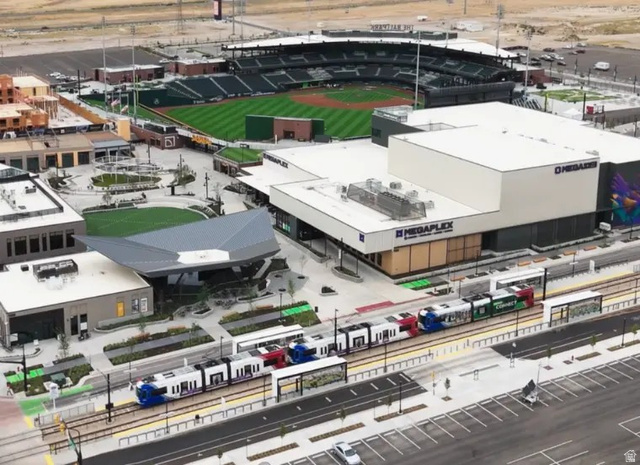 11014 South Lake Run Road, Unit 146 South Jordan, UT 84009 - Photo 17 of 22 Modern community featuring a light rail station, open green spaces, a baseball stadium, and commercial buildings