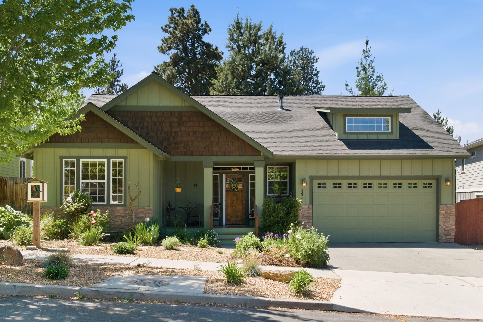 62944 Fresca Street Bend, OR 97703 - Photo 1 of 32 a view of a house with potted plants
