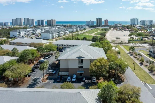 an aerial view of residential houses and outdoor space