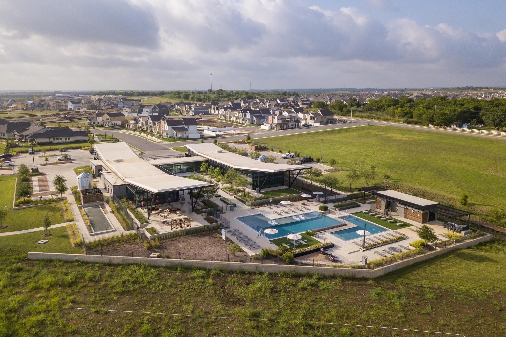8405 Hubble Walk Austin, TX 78744 - Photo 34 of 36 Aerial perspective of suburban area featuring a pool