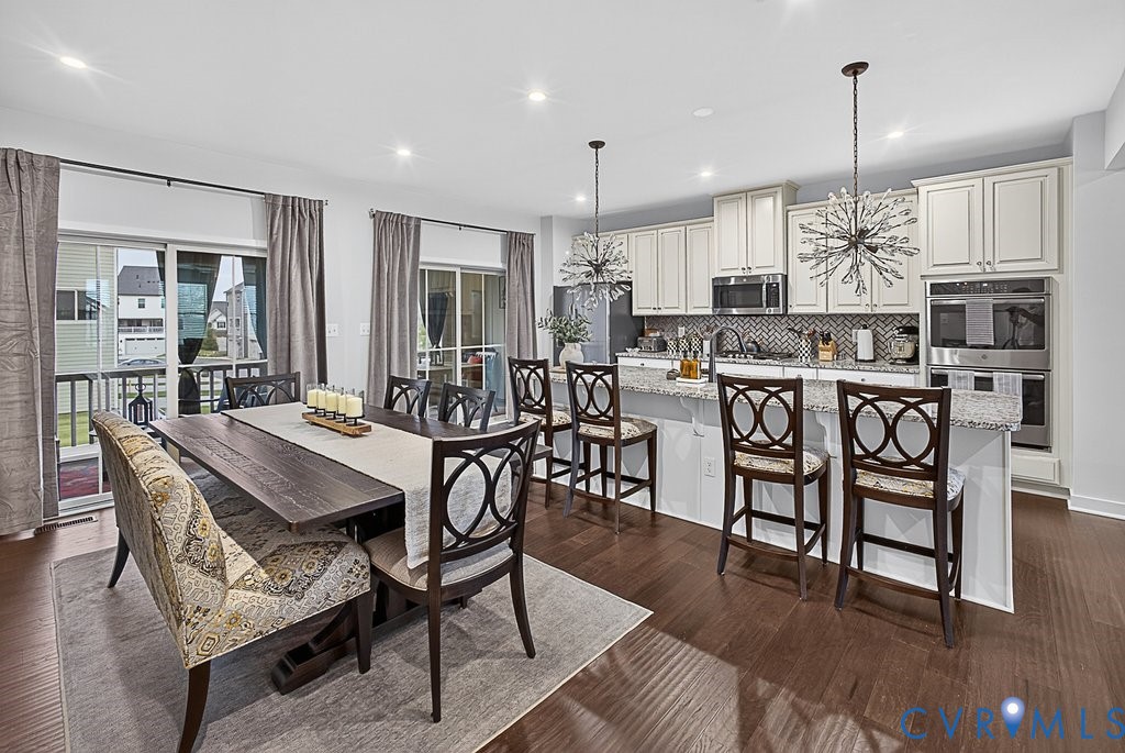 17976 Spotted Oak Road Dumfries, VA 22026 - Photo 12 of 52 Open-concept kitchen and dining area featuring woo