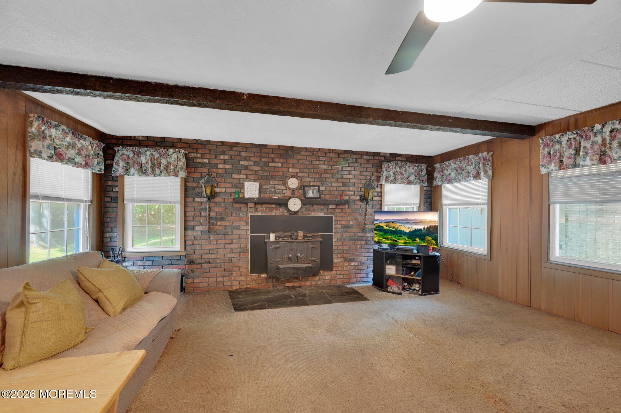 2604 Logan Road Asbury Park, NJ 07712 - Photo 15 of 39 a living room with fireplace furniture and a window