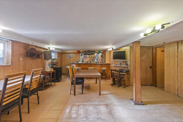 a kitchen with a table and chairs in it