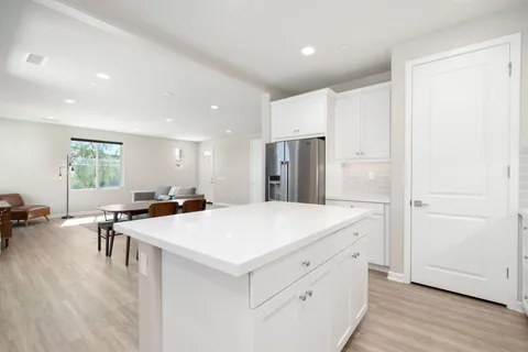 a view of kitchen with center island and stainless steel appliances