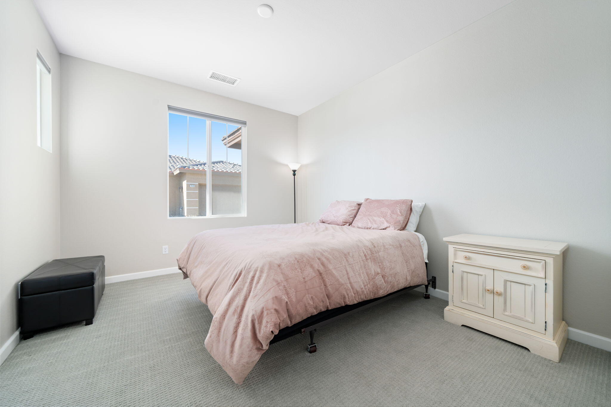 74338 Millennia Way Palm Desert, CA 92211 - Photo 20 of 33 a spacious bedroom with a bed and a tv