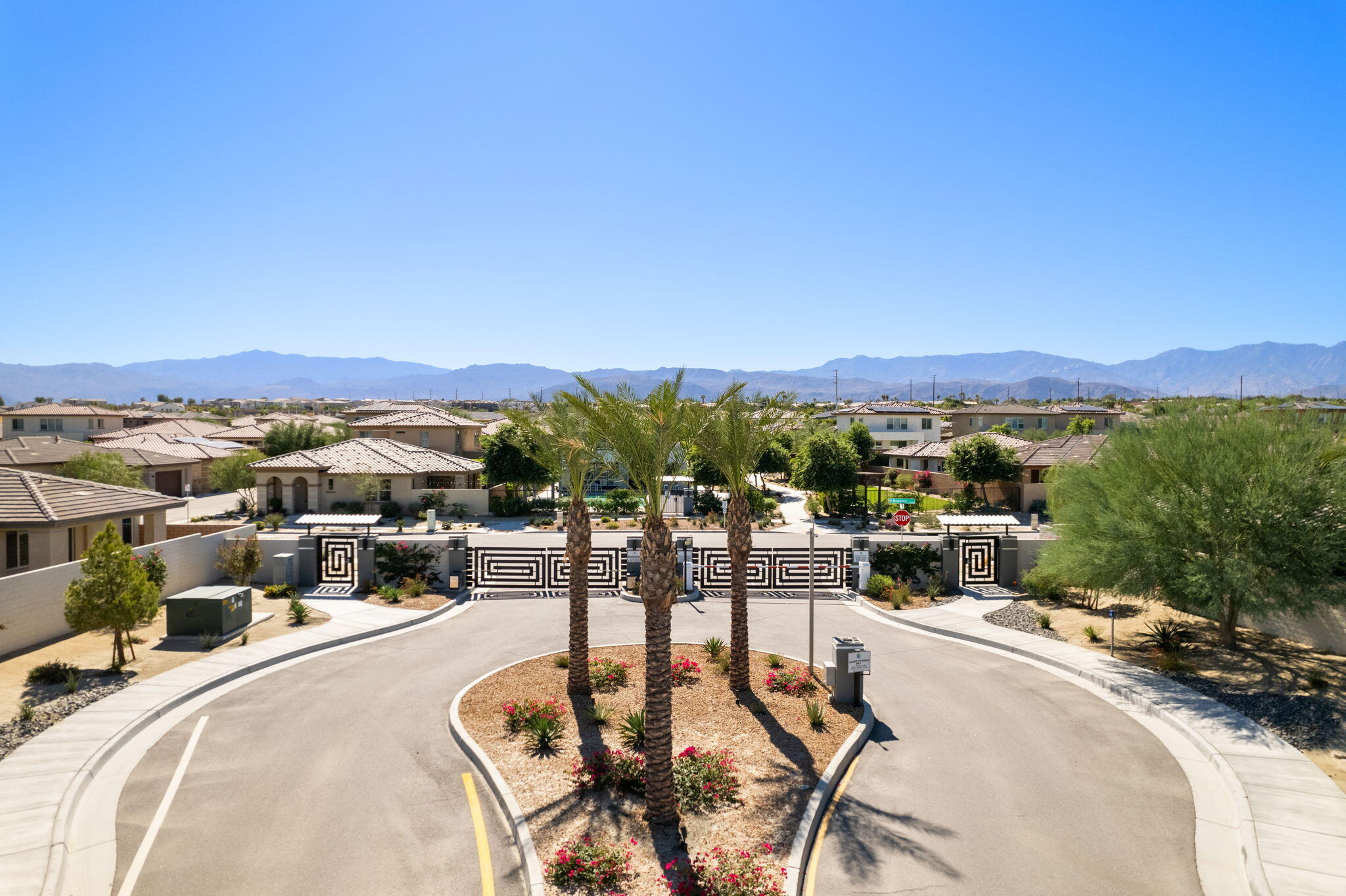 74338 Millennia Way Palm Desert, CA 92211 - Photo 27 of 33 a view of a swimming pool with a table and chairs