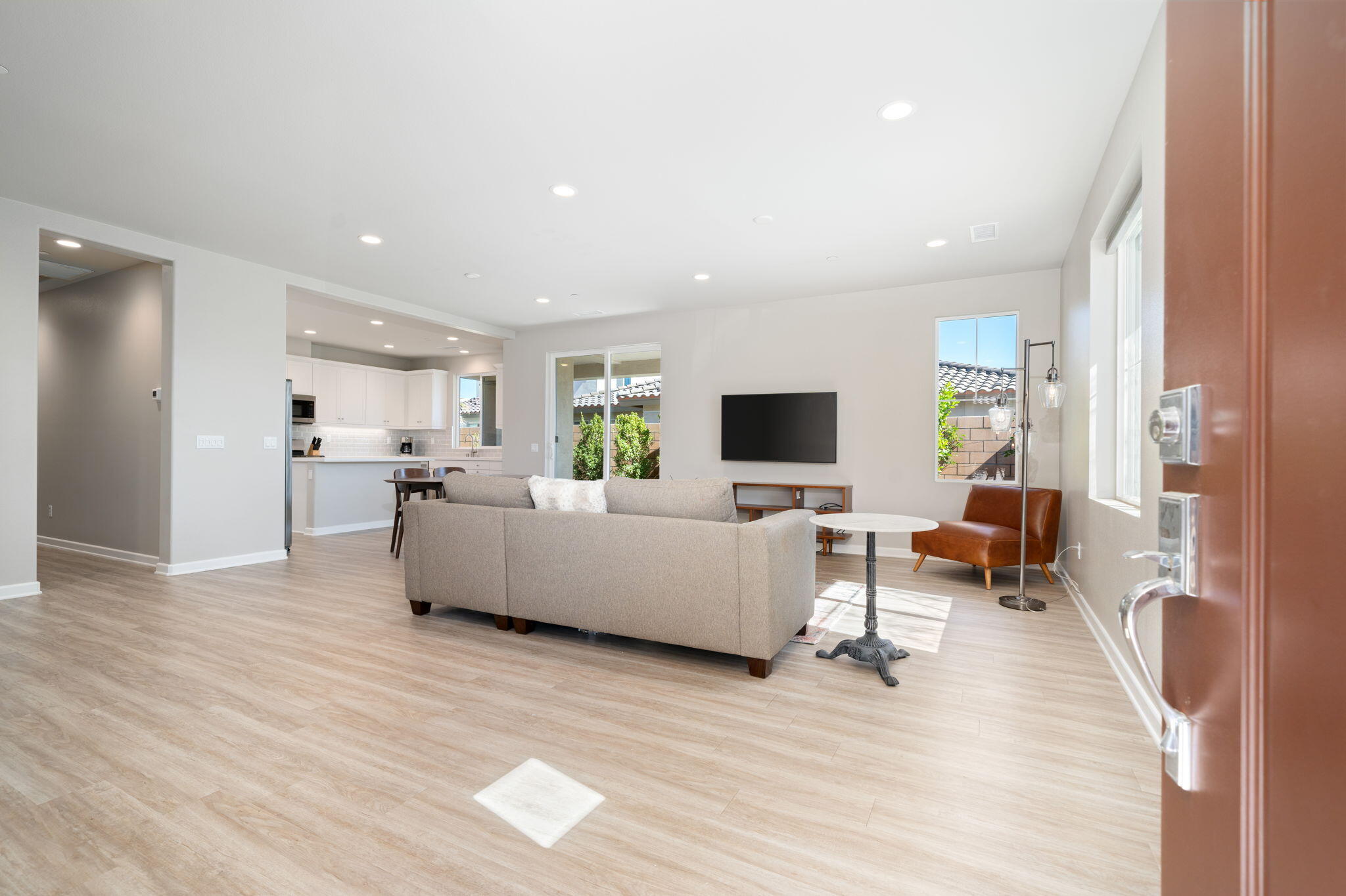 74338 Millennia Way Palm Desert, CA 92211 - Photo 5 of 33 a living room with furniture and a flat screen tv