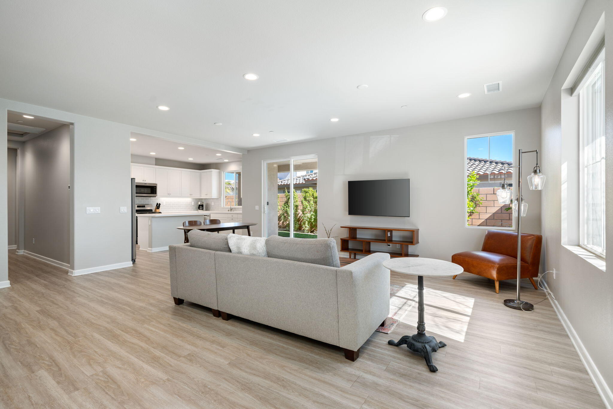 74338 Millennia Way Palm Desert, CA 92211 - Photo 6 of 33 a living room with furniture and a flat screen tv