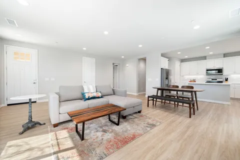 a living room with furniture and a table