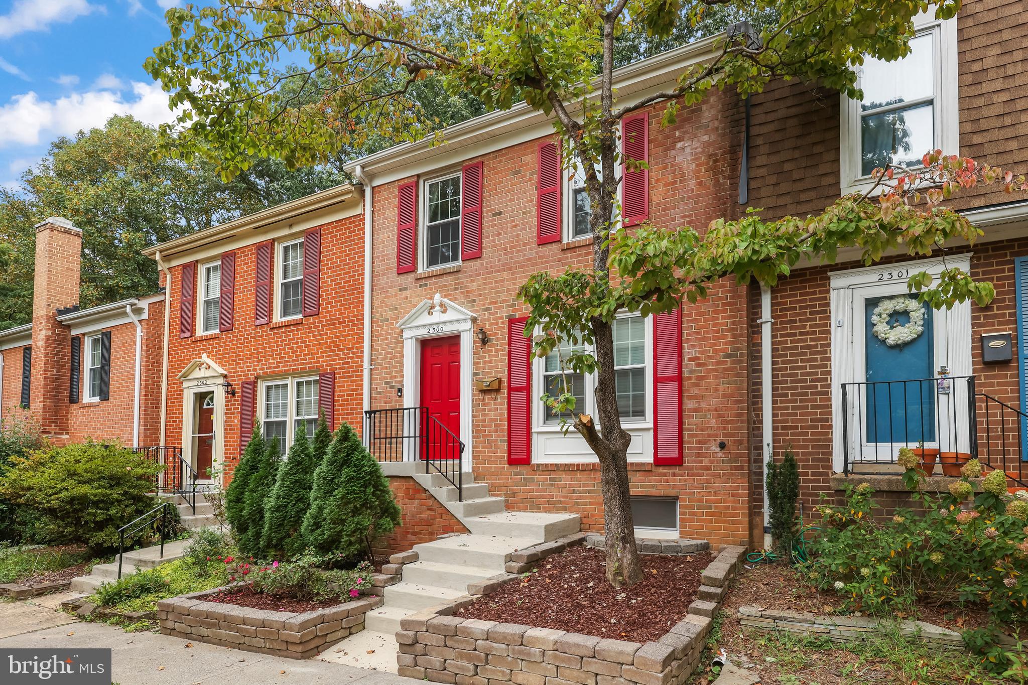 2300 Horseferry Court Reston, VA 20191 - Photo 3 of 6 a front view of a house with a yard