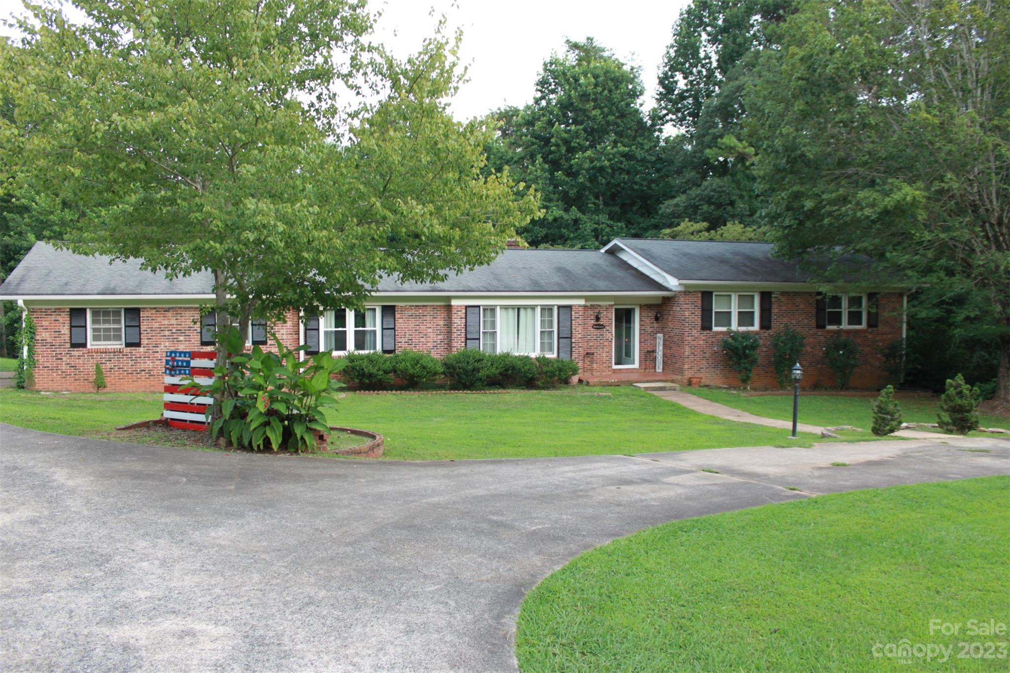 901 Coopers Gap Road Rutherfordton, NC 28139 - Photo 1 of 47 a front view of a house with a yard and porch