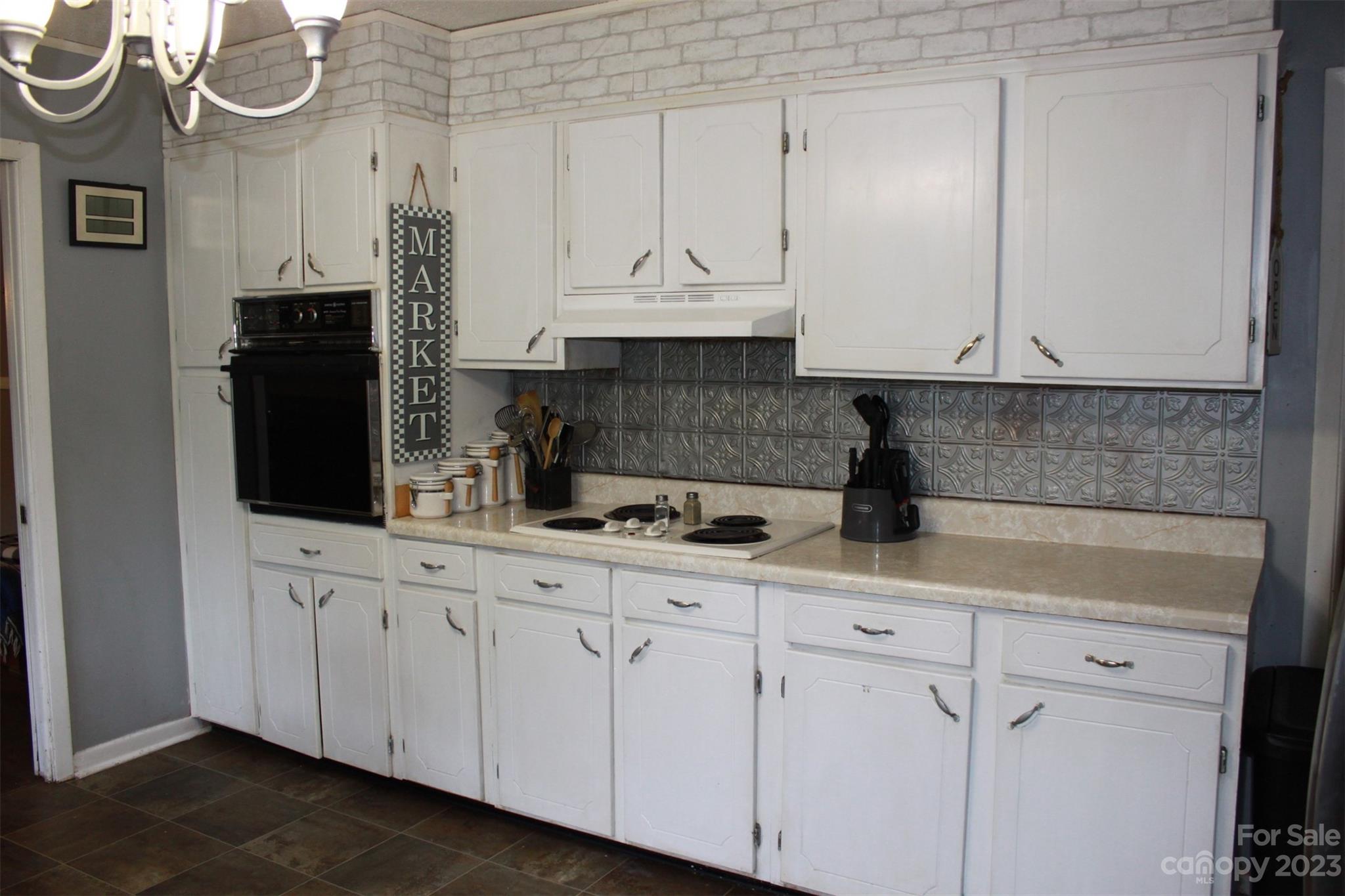 901 Coopers Gap Road Rutherfordton, NC 28139 - Photo 13 of 47 a kitchen with a sink and cabinets